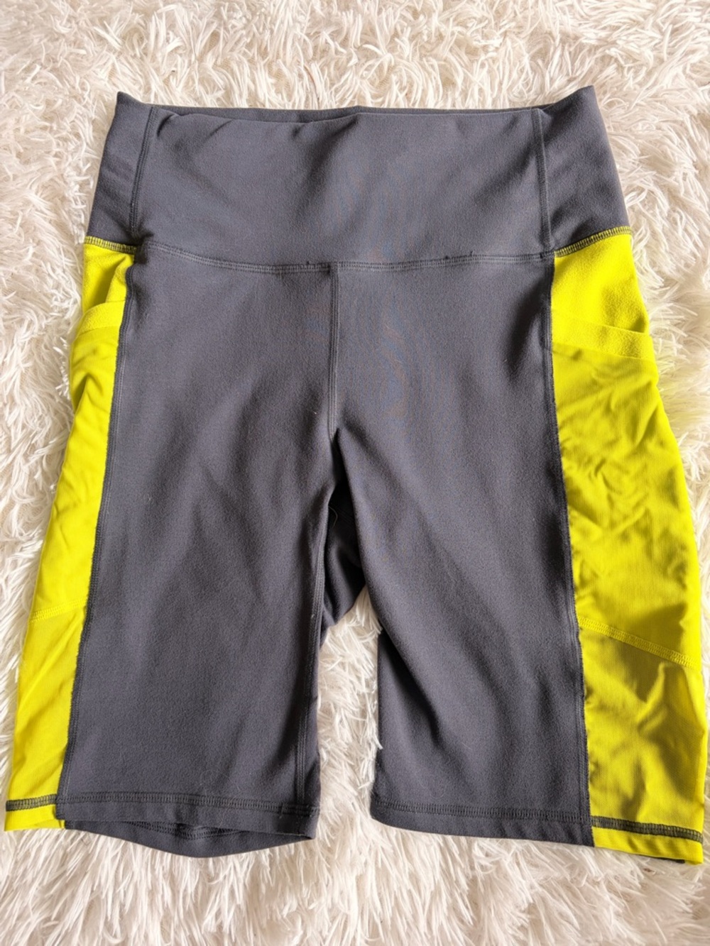 Fabletics Charcoal Gray Bike Shorts with Neon Yellow Stripe